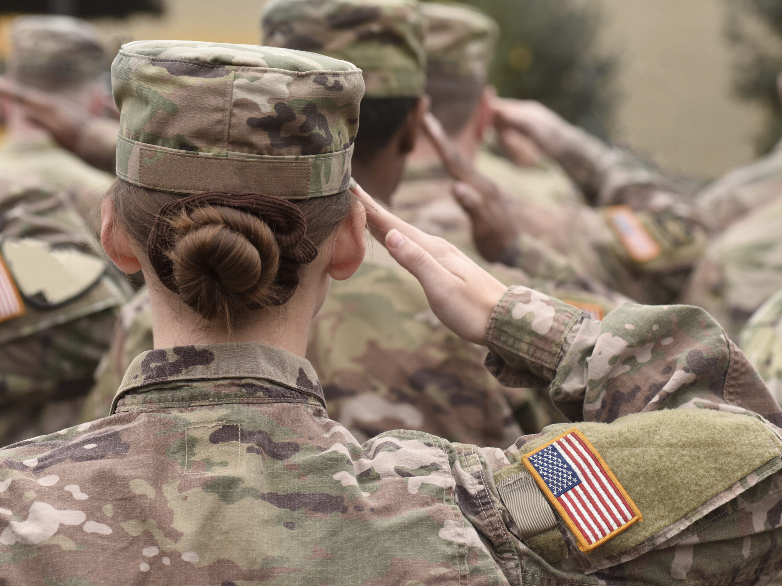 American soldiers salute. Photo: Bumble Dee via Shutterstock.com